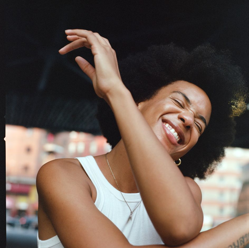 [A Woman With Black Hair Smiling Happily In A City Setting](https://www.stills.com/images/a-woman-with-black-hair-smiling-happily-in-a-city-setting/28960) by Anne Holiday